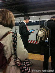 iPad being used while waiting for a train